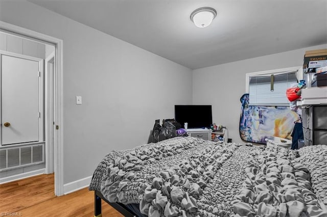 803 Buckner St, Graham, NC 27253 - bedroom with wood finished floors and baseboards
