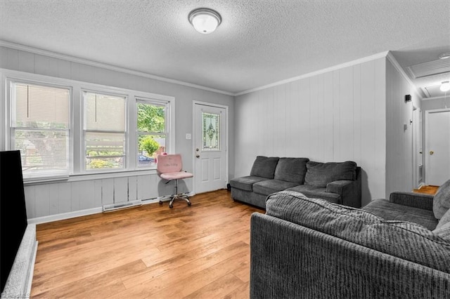 803 Buckner St, Graham, NC 27253 - living room featuring ornamental molding, attic access, light wood finished floors, and a textured ceiling