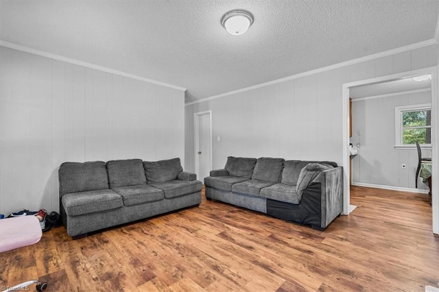 803 Buckner St, Graham, NC 27253 - living room with wood finished floors, crown molding, and a textured ceiling