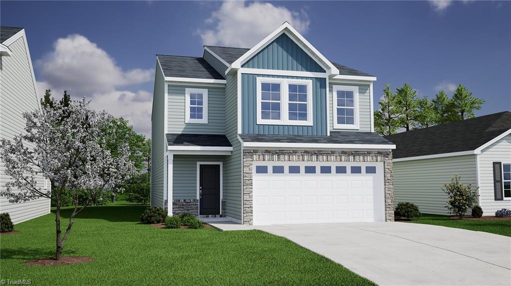 view of front facade featuring board and batten siding, a garage, stone siding, driveway, and a front lawn