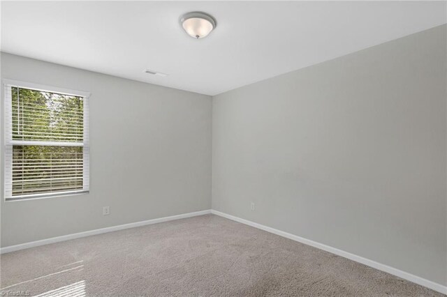 3710 Streamside Dr, Thomasville, NC 27360 - carpeted spare room featuring baseboards
