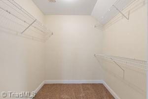 2108 Glenside Dr, Greensboro, NC 27405 - walk in closet featuring carpet floors