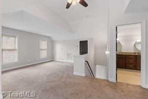 2108 Glenside Dr, Greensboro, NC 27405 - spare room featuring carpet flooring and ceiling fan