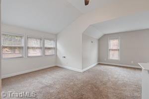 2108 Glenside Dr, Greensboro, NC 27405 - bonus room with lofted ceiling, healthy amount of natural light, a ceiling fan, and carpet