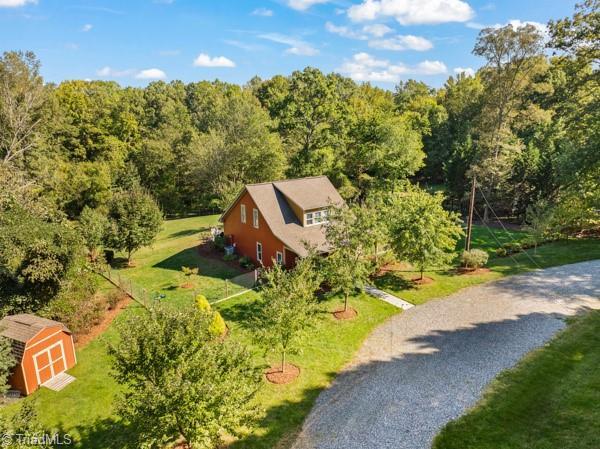 2108 Glenside Dr, Greensboro, NC 27405 - view from above of property with a heavily wooded area