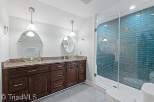 2108 Glenside Dr, Greensboro, NC 27405 - bathroom featuring a shower stall, double vanity, and recessed lighting