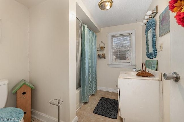 full bathroom featuring shower / bath combo, vanity, and toilet