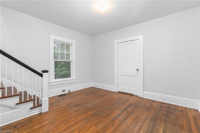 spare room featuring dark hardwood / wood-style flooring