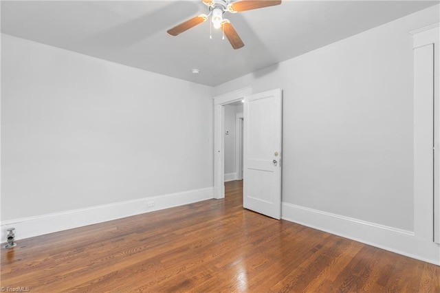 empty room featuring hardwood / wood-style floors and ceiling fan