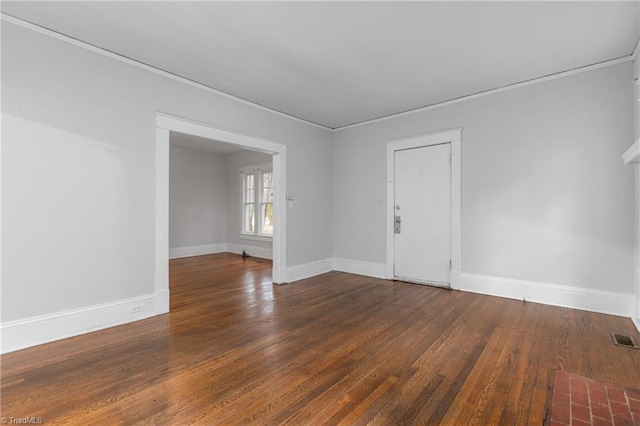 spare room with dark hardwood / wood-style floors