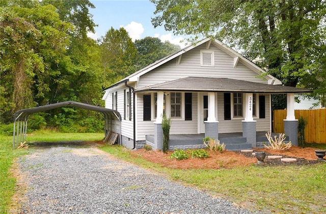 view of front facade featuring a carport and a porch