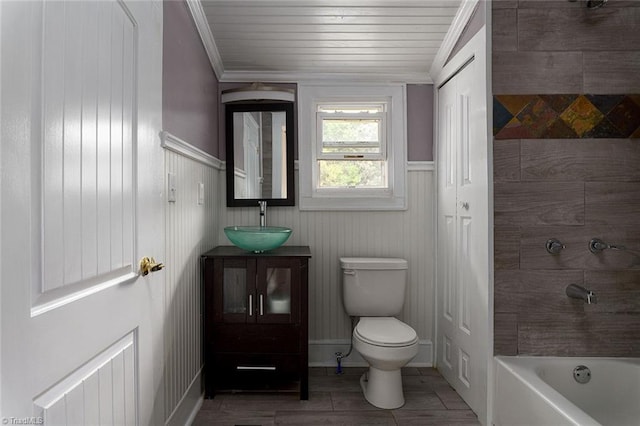 full bathroom with tub / shower combination, vanity, wooden ceiling, ornamental molding, and toilet