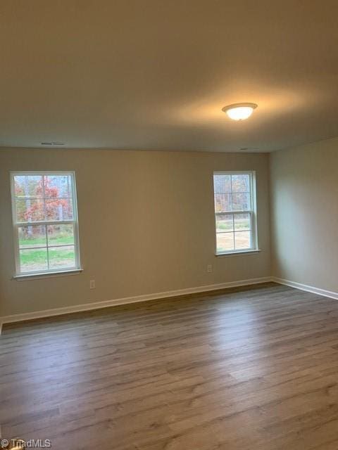 empty room featuring wood-type flooring