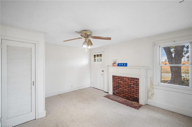 living room with light colored carpet, a tile fireplace, and ceiling fan