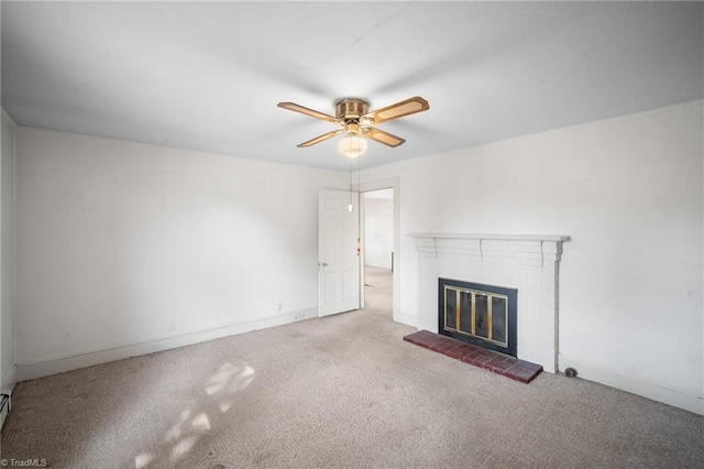 unfurnished living room featuring a brick fireplace, ceiling fan, and carpet