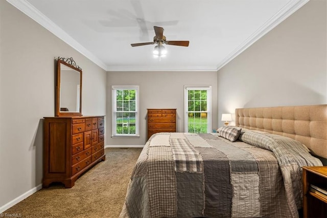 bedroom featuring carpet floors, baseboards, ornamental molding, and ceiling fan