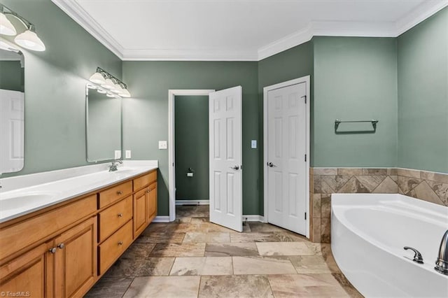 full bathroom with crown molding, a sink, and a bath