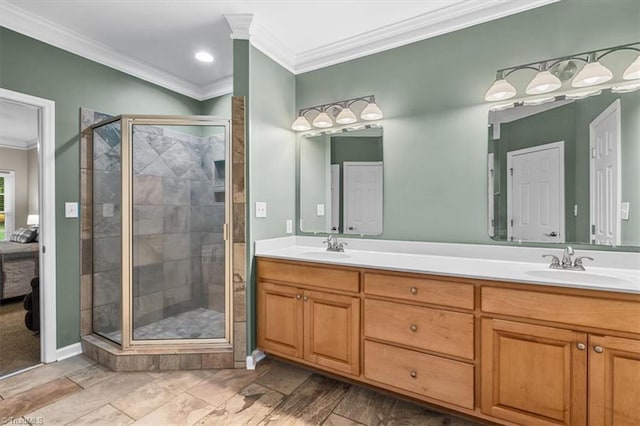 ensuite bathroom with double vanity, a stall shower, a sink, connected bathroom, and ornamental molding