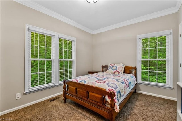 carpeted bedroom with baseboards, ornamental molding, and multiple windows