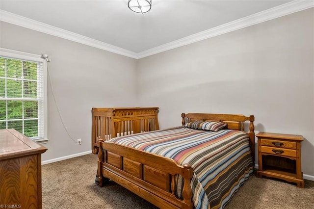 bedroom with carpet floors, baseboards, and ornamental molding