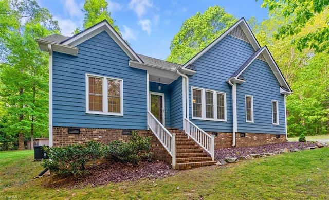ranch-style home featuring stairs, a front yard, and crawl space