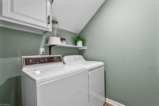 laundry area with cabinet space and washer and clothes dryer