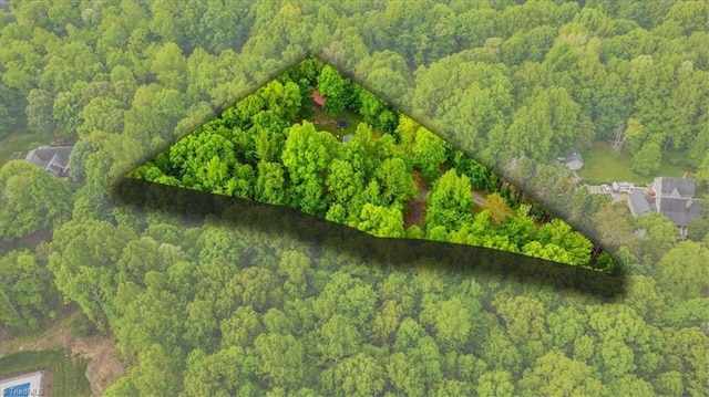 aerial view featuring a view of trees