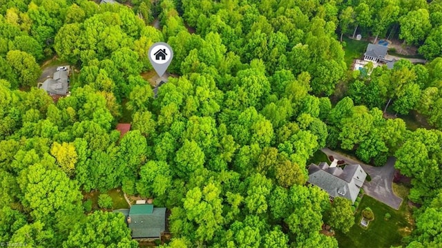 bird's eye view with a forest view