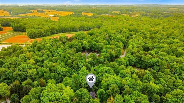 drone / aerial view with a view of trees