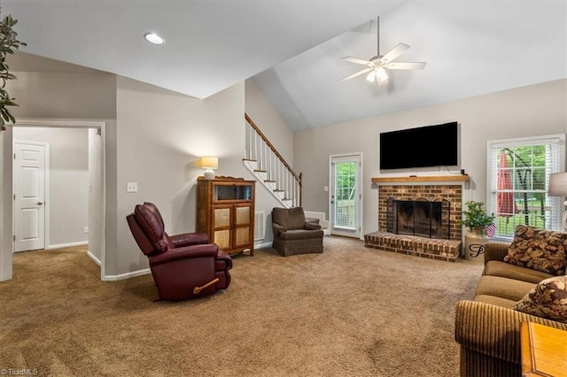living room featuring carpet floors, a ceiling fan, plenty of natural light, and lofted ceiling