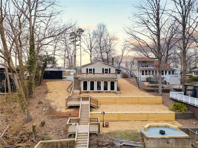 view of back house at dusk