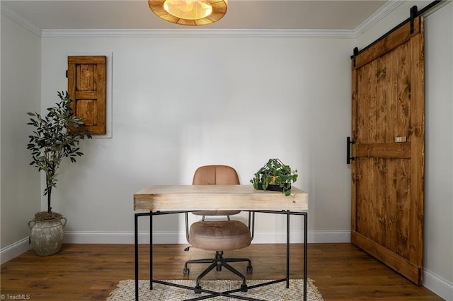 home office featuring ornamental molding, a barn door, and dark hardwood / wood-style floors