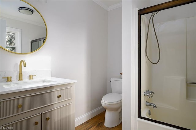 full bathroom with hardwood / wood-style floors, enclosed tub / shower combo, vanity, toilet, and crown molding