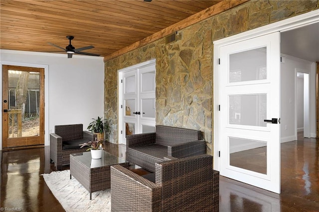 interior space featuring ceiling fan and french doors