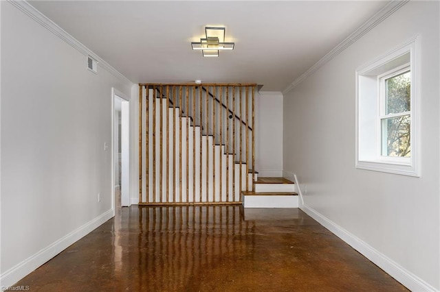 staircase featuring ornamental molding and concrete flooring