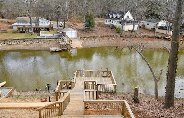 view of dock with a deck with water view