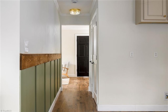 hallway featuring crown molding and dark hardwood / wood-style floors