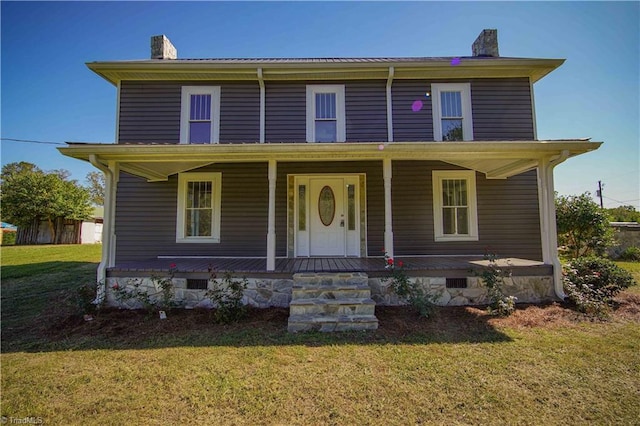 view of front facade with a porch and a front yard