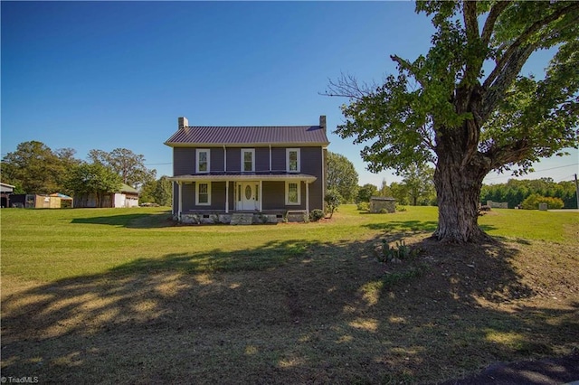 view of front of property featuring a porch and a front yard