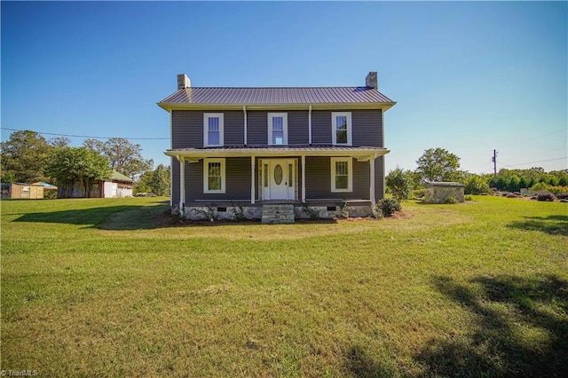 rear view of property with a lawn and a porch