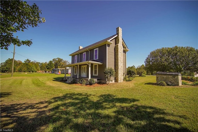 view of property exterior featuring covered porch and a lawn