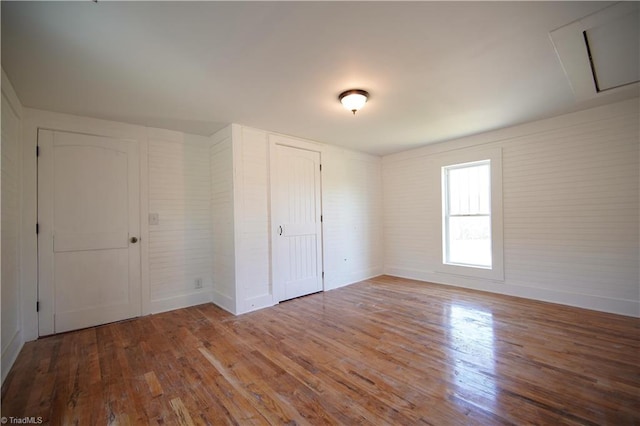 unfurnished bedroom featuring wood-type flooring