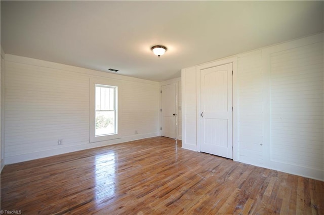 unfurnished bedroom with wood-type flooring