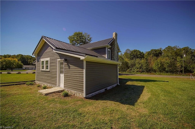 view of property exterior featuring a lawn