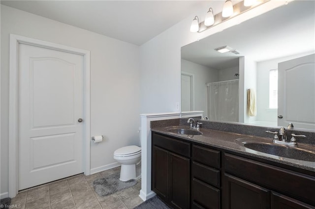 bathroom featuring a shower with curtain, tile patterned flooring, vanity, and toilet