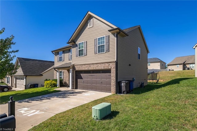 view of front facade with a garage and a front lawn