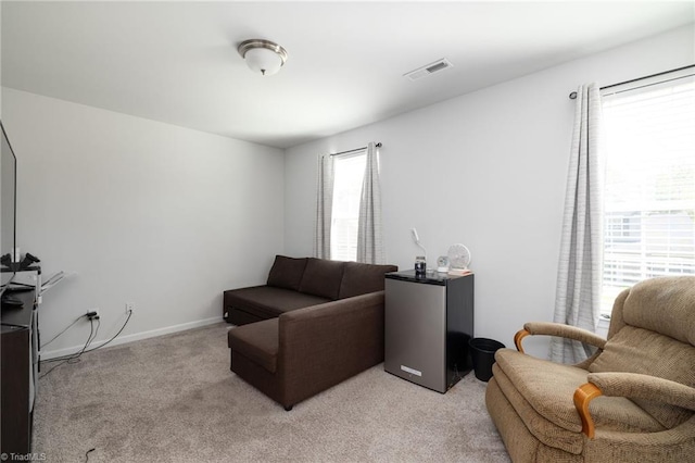 living room featuring light colored carpet