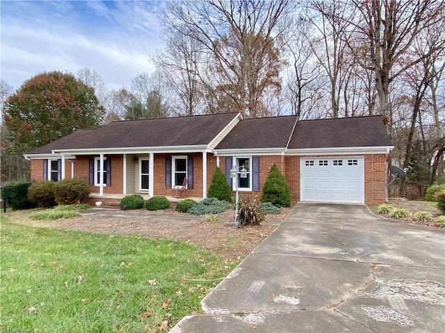 single story home with a front yard and a garage