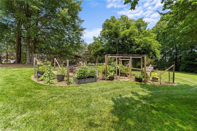 1805 Guilford College Rd, Jamestown, NC 27282 - view of green lawn featuring a garden and view of scattered trees