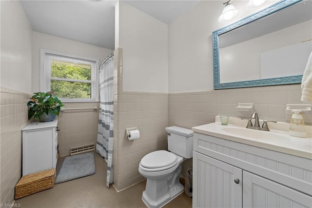 1805 Guilford College Rd, Jamestown, NC 27282 - bathroom featuring tile walls, toilet, vanity, a wainscoted wall, and curtained shower